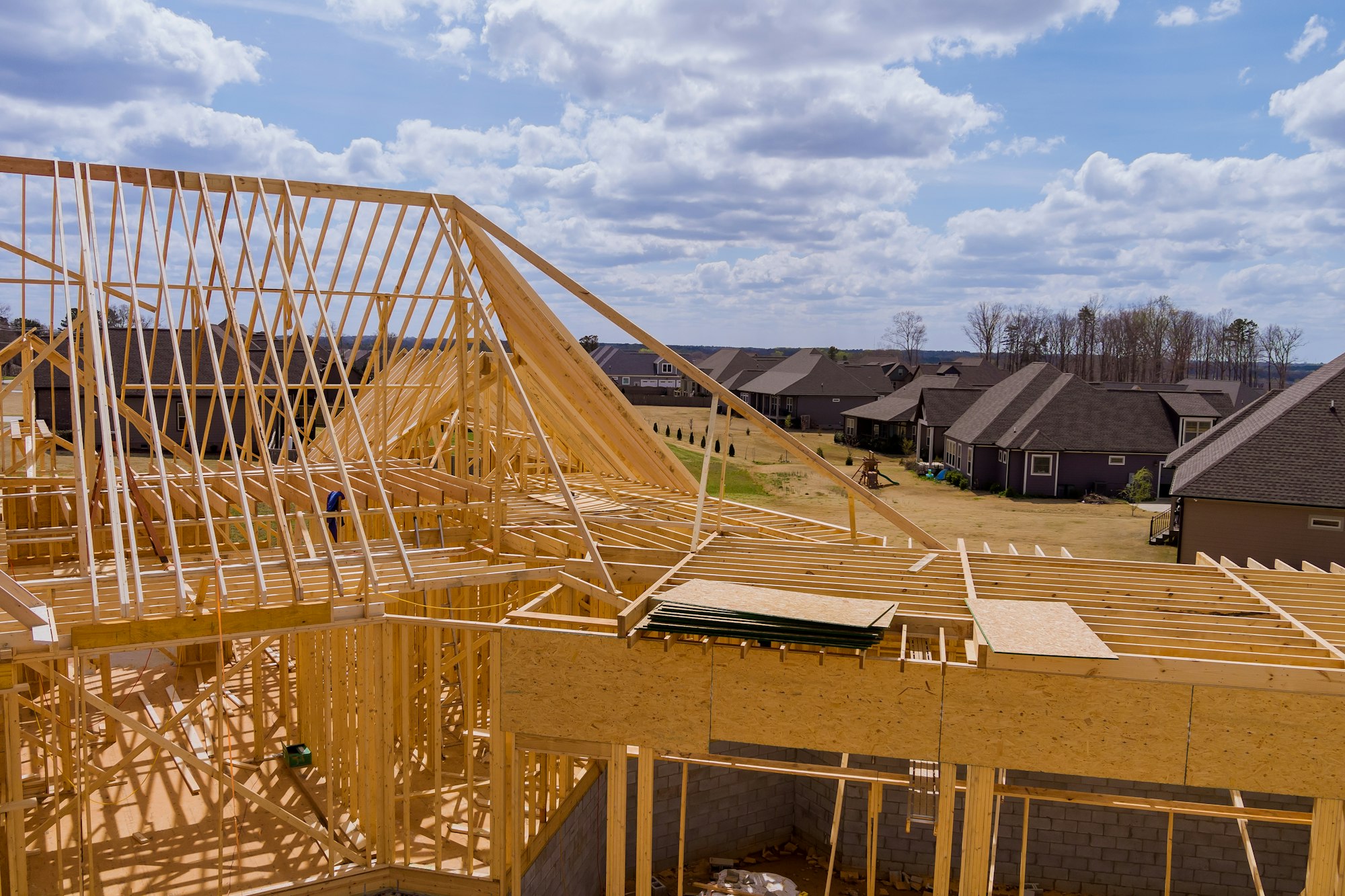 Aerial view of unfinished house with wooden frame