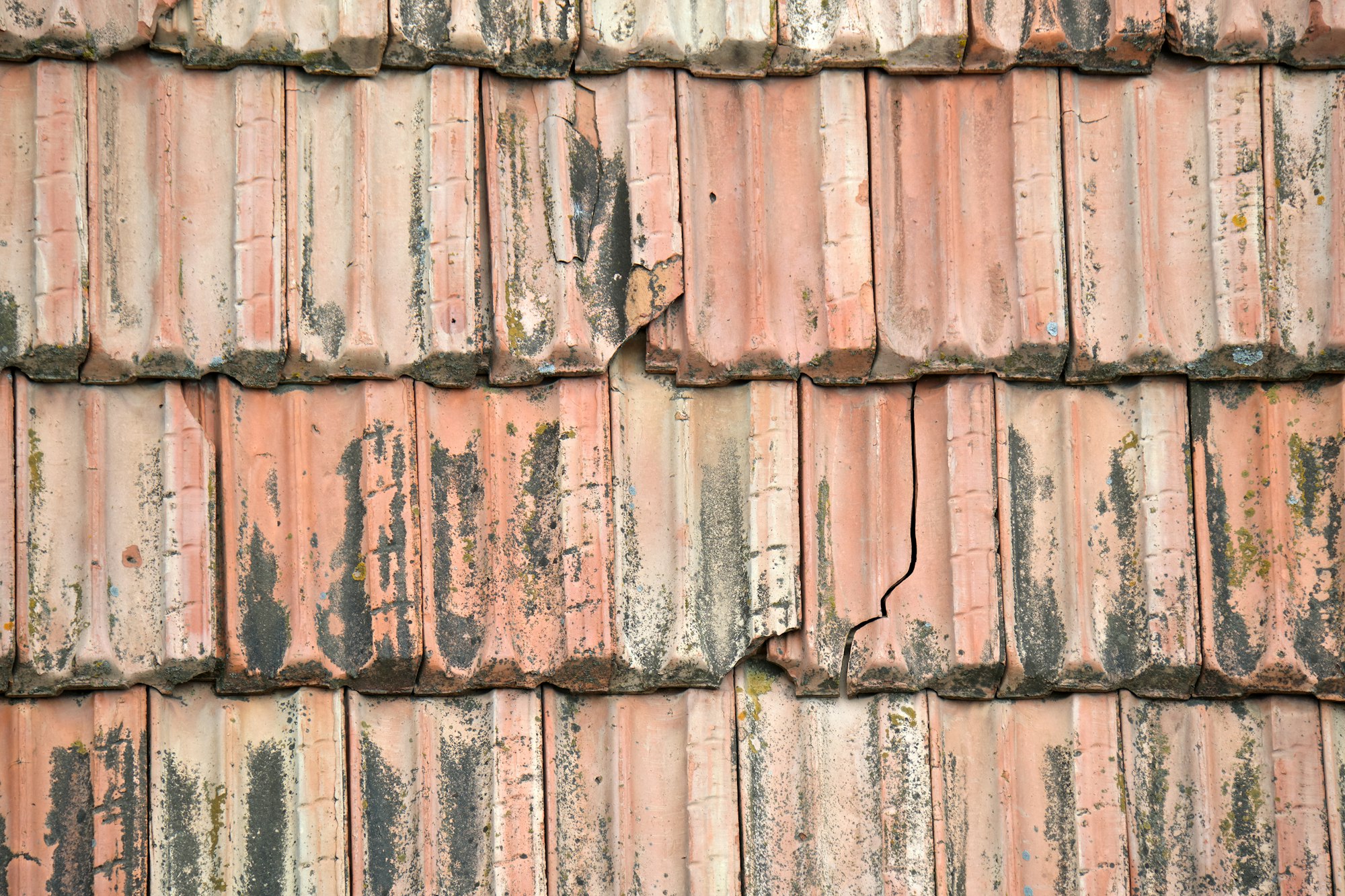 Closeup surface of old weathered ceramic tiles covering building roof