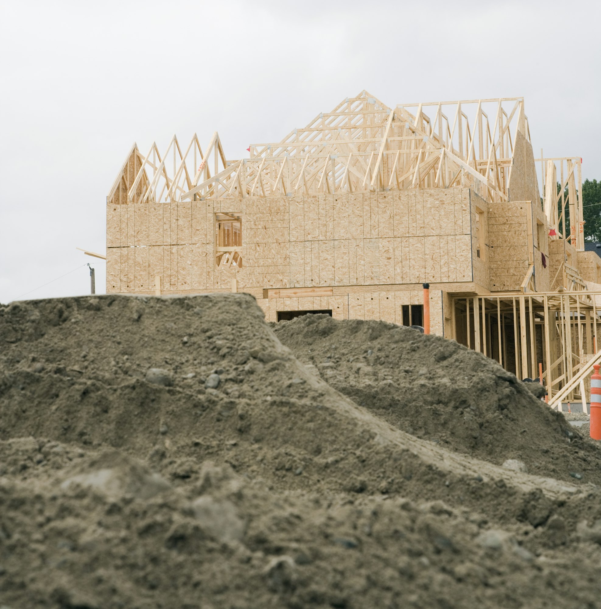 Wooden building frame on construction site.